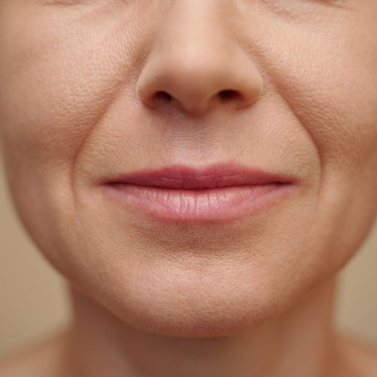 Lower face part of smiling mature woman